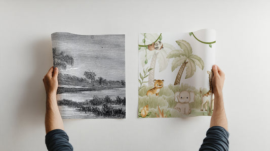 A Man Holding Two Different Roles Of Washable Wallpaper With One Hand Holding a Black And White River Scene And The Other With A Kids Safari Design