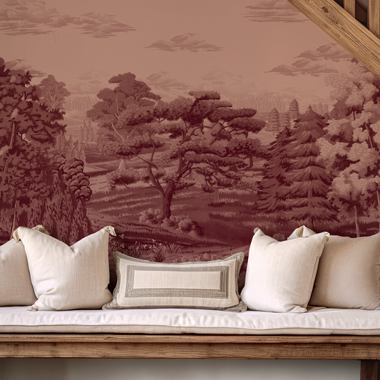 Wooden bench with white cushions against a wall with nature-themed wallpaper