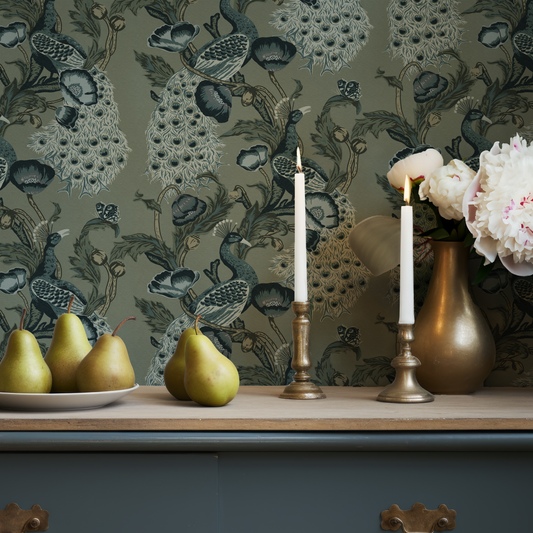 Blue peacock wallpaper with a blue cabinet and pears