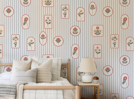 Floral stamp wallpaper in a bedroom with white pillows and white lamp