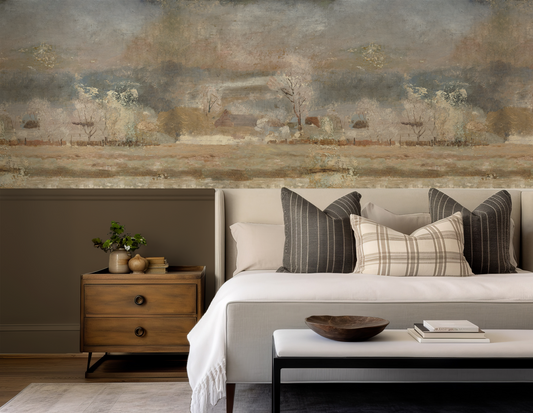 Living room with a large wall mural, sofa with decorative pillows, and wooden side table.