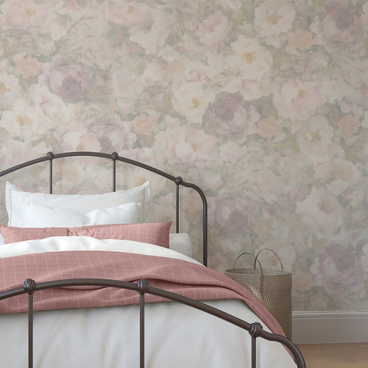 Bedroom with floral wallpaper and a bed with pink and white bedding.