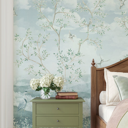 Bedroom with floral wallpaper, green nightstand, and wooden bed.