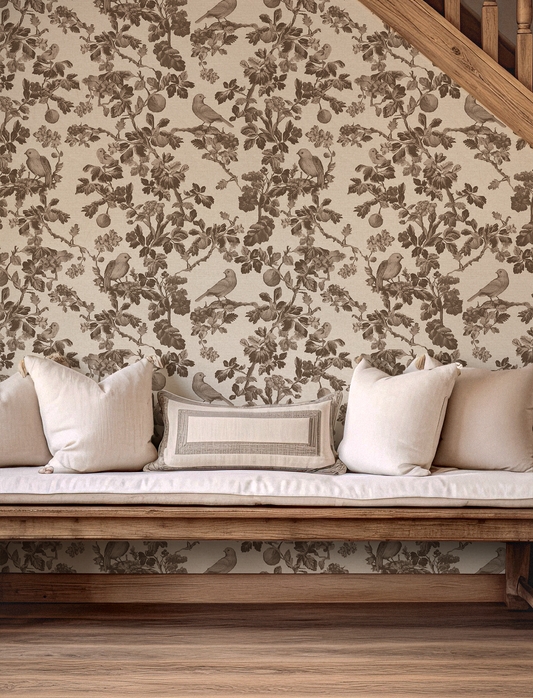 Floral wallpaper with birds in a room with a wooden bench and cushions.