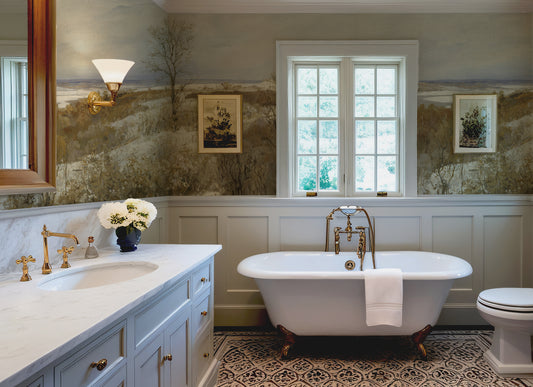 Bathroom with freestanding bathtub, sink, and window