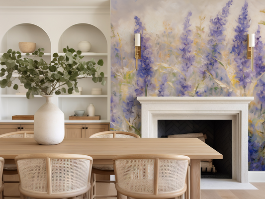 Dining room with wooden table, chairs, and a fireplace with floral wallpaper.