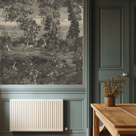 Katharine Mono Wallpaper Room interior with wallpaper featuring a garden scene, radiator, and wooden table.