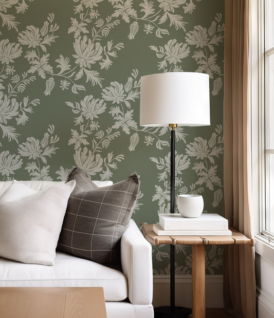 Living room with floral wallpaper, white sofa, and wooden side table.
