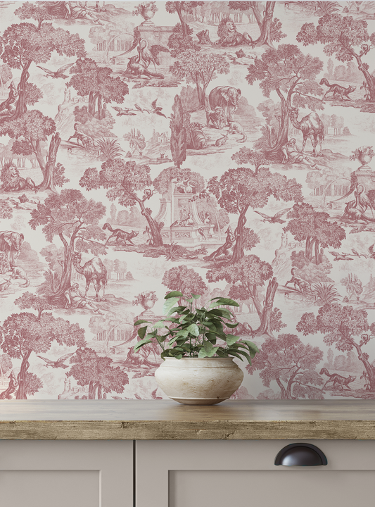 Wallpaper with pink and green nature-themed design on a wall behind a wooden cabinet with a plant.