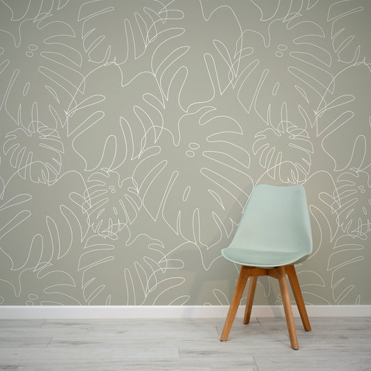 Minimal Monstera Green Wallpaper In Room With Grey Chair