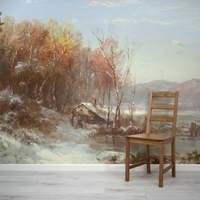 Wooden chair in front of a winter landscape mural on a wall.