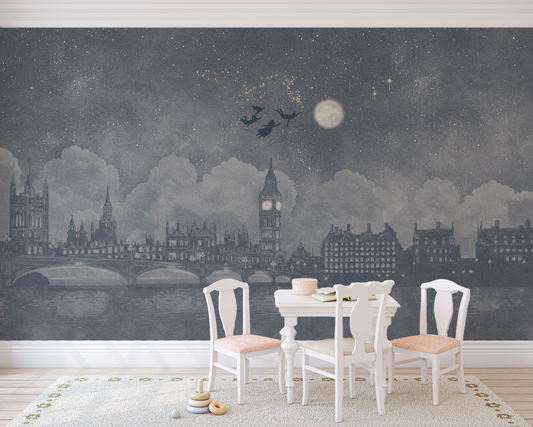 Watercolour London skyline Peter Pan inspired mural in a children's play room with a white colouring table and chairs 