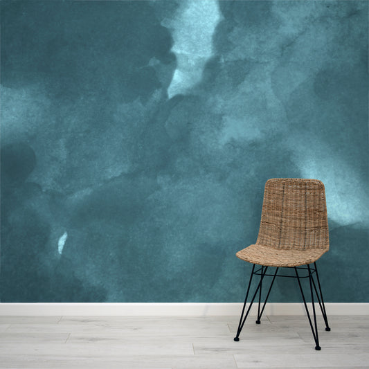 Onimbus Moody Teal Watercolour Cloud Wallpaper Mural with a Rattan Chair