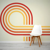 Retro Spiral Mural Reds Wallpaper in living room with small white plastic chair