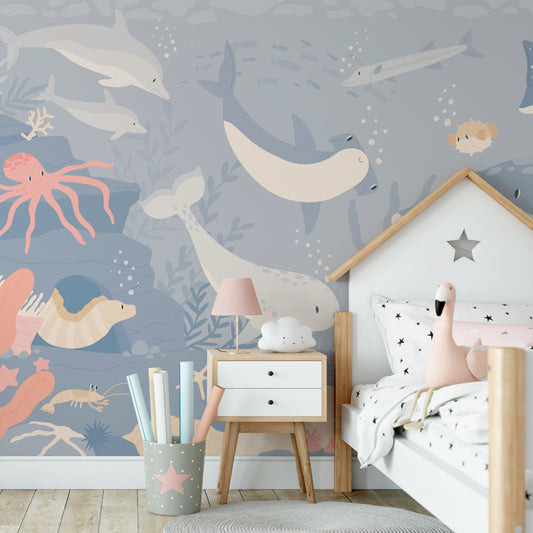 Submerged Fantasia Wallpaper in girl's bedroom with bed in the shape of a house with star bedding sheets and toy flamingo on top of bed
