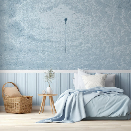 Theo Sky Wallpaper In Children's Bedroo With Single Baby Blue Bed, Blue Panelled Walls And Wooden Baskets