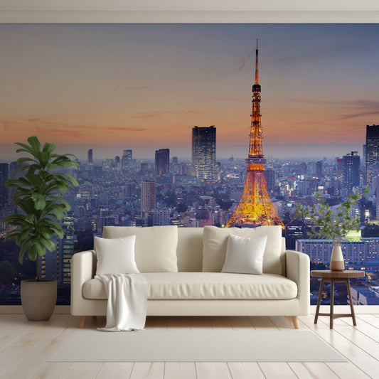 Tokyo Tower Wallpaper In Living Room With White Sofa, Cushions And Blankets With Green Tall Plants Either Side Of The Sofa