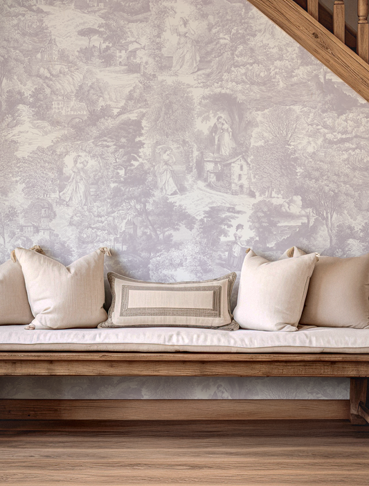 Wooden bench with beige cushions against Victoria wallpapered wall.