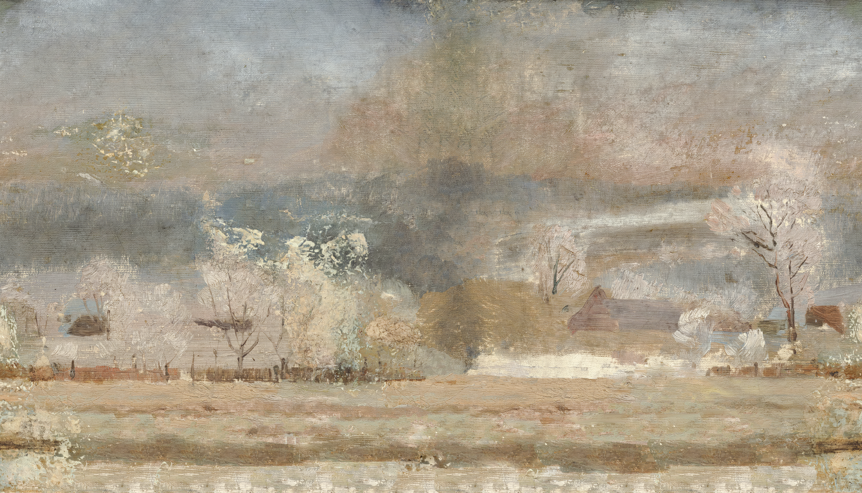 Wintery landscape with bare trees and a misty sky
