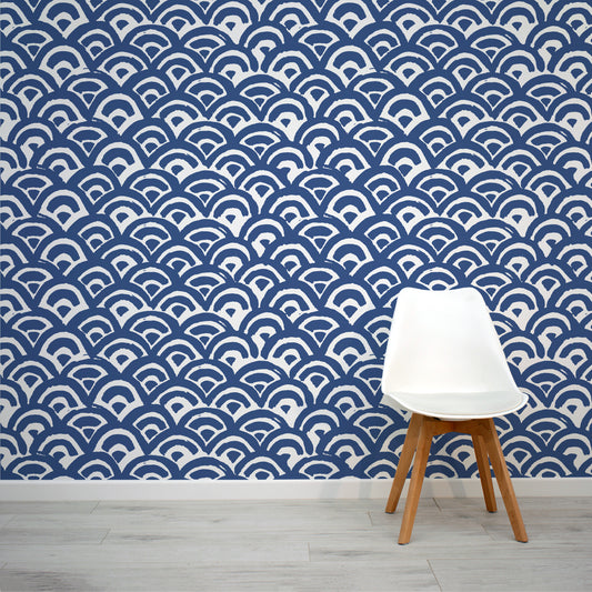 Heed Blue Wave Painted Pattern Wall Mural with a stylish white chair